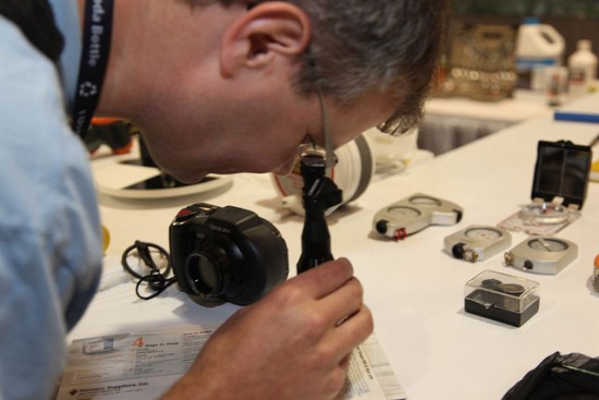 • Photo of an AFS member looking through a microscope for the American Fisheries Society Mission Statement page