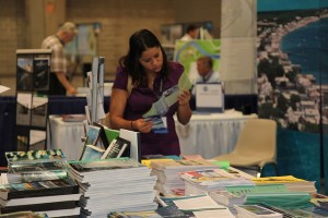 Photo of at the Annual Meeting of an AFS Member looks at American Fisheries Society books