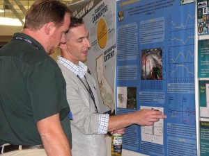 Photo of two members at the annual meeting poster session of the American Fisheries Society annual meeting
